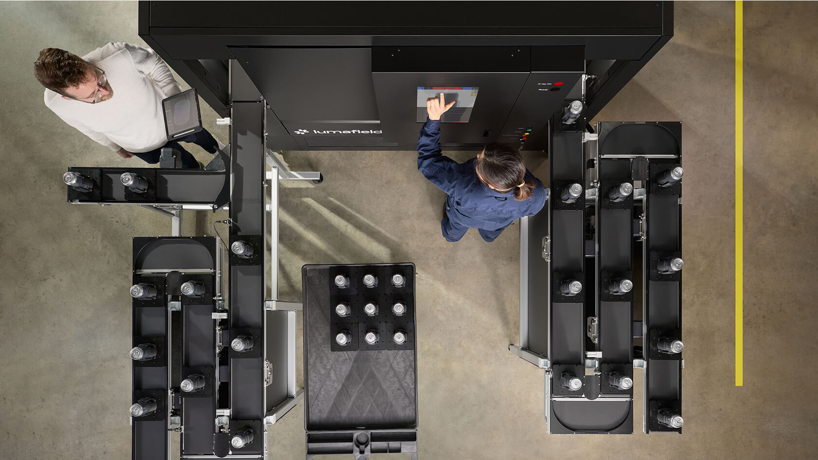 Lumafield industrial CT system with conveyor-integrated inline inspection on a production floor